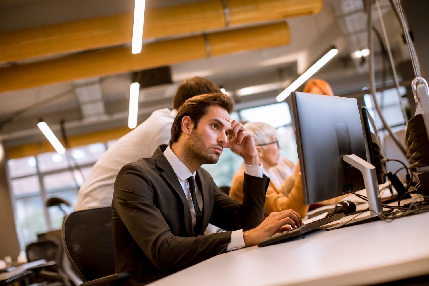 IT specialist configuring data systems for optimal performance