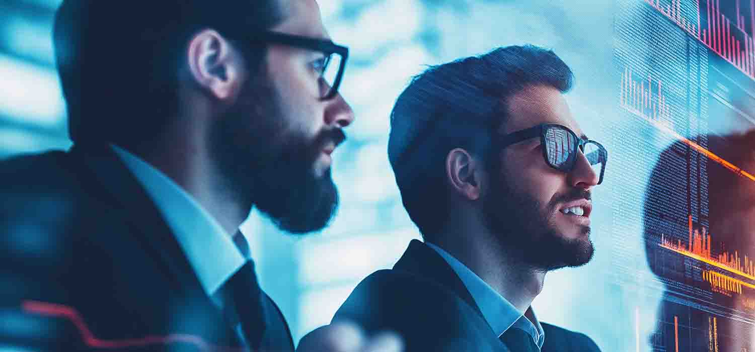 Cybersecurity team analysing and discussing threat data on digital screens in a secure operations centre.